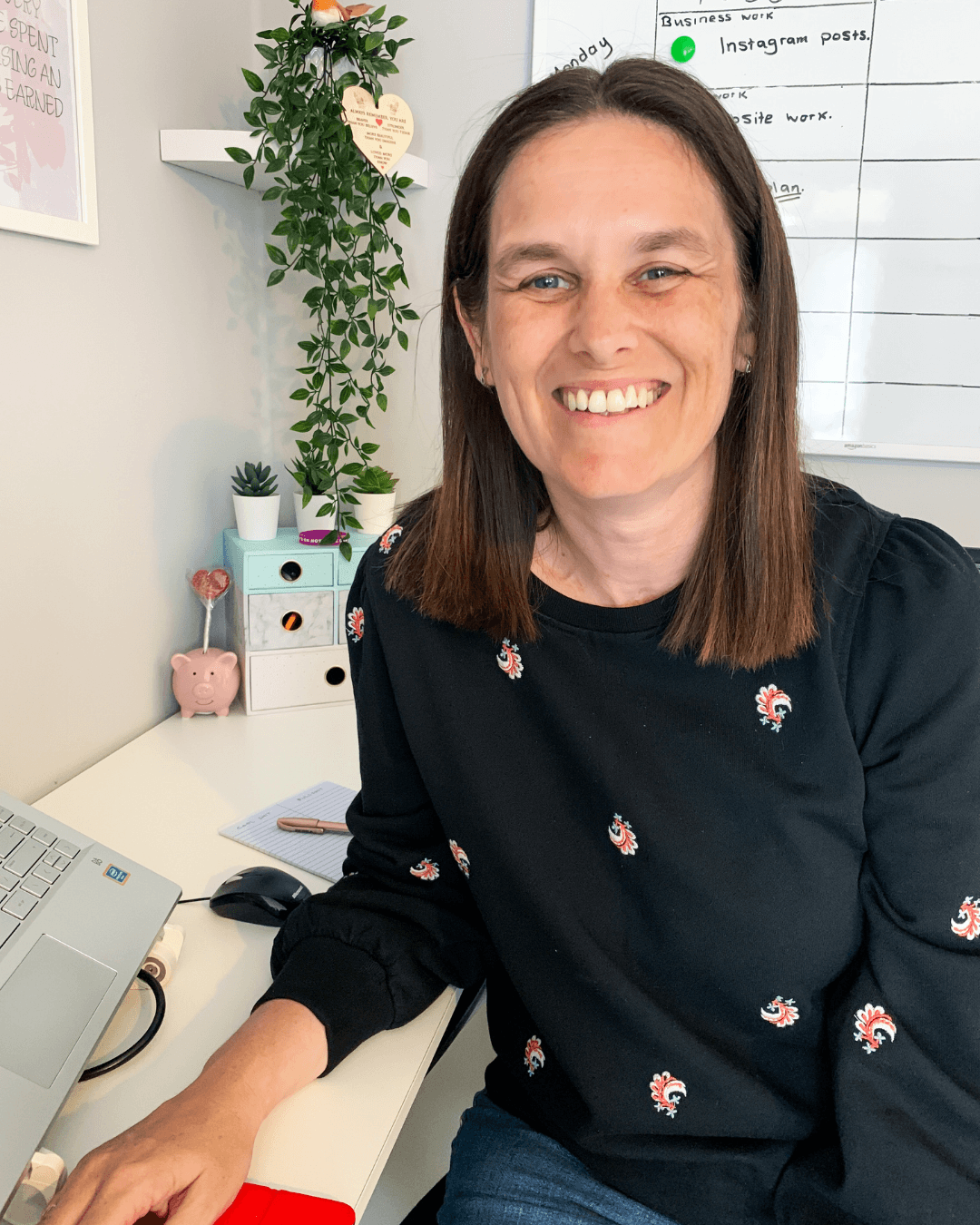 Carol Jamieson smiling at her desk